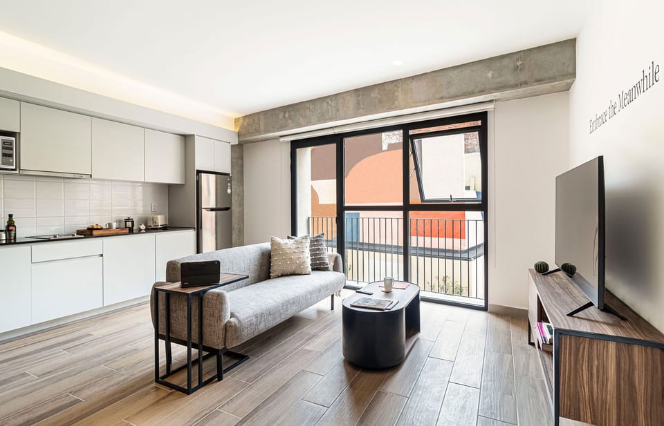 The building contains several similar units, Furniture, decor, and amenities may vary.