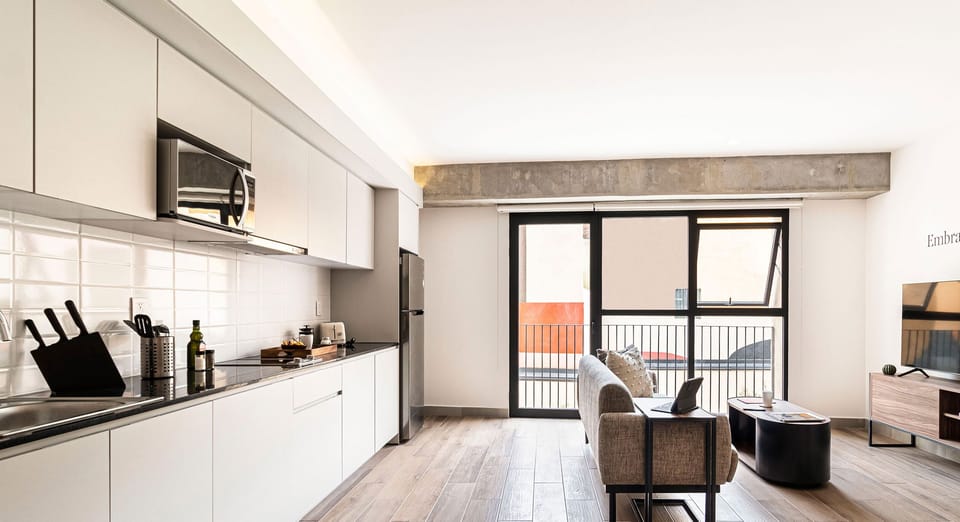 The building contains several similar units, Furniture, decor, and amenities may vary.