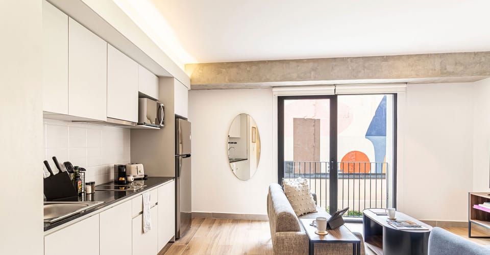 The building contains several similar units, Furniture, decor, and amenities may vary.