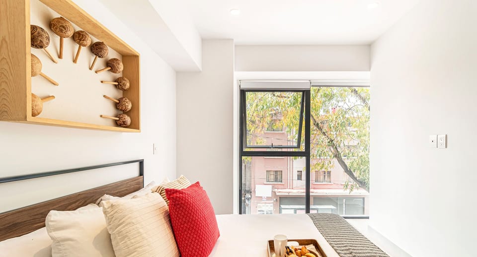 The building contains several similar units, Furniture, decor, and amenities may vary.