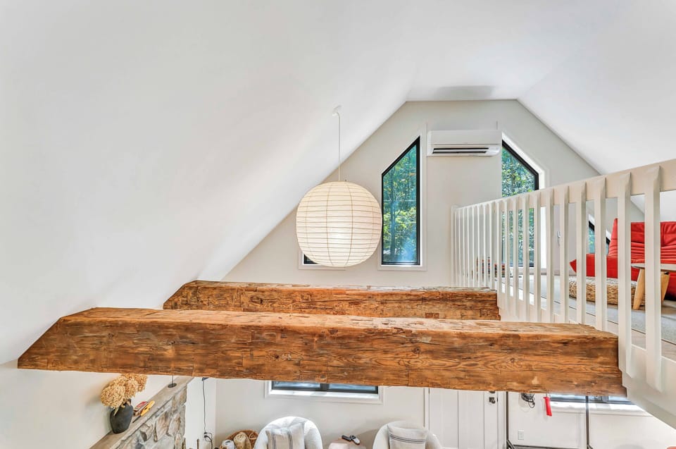 Large windows flood the space with natural light, enhancing the inviting atmosphere.