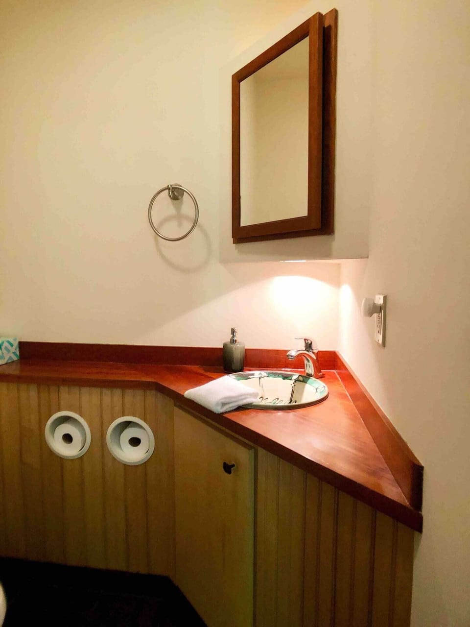 The half bath just off the living room has a handmade sink by friends at Fork Mountain Pottery.