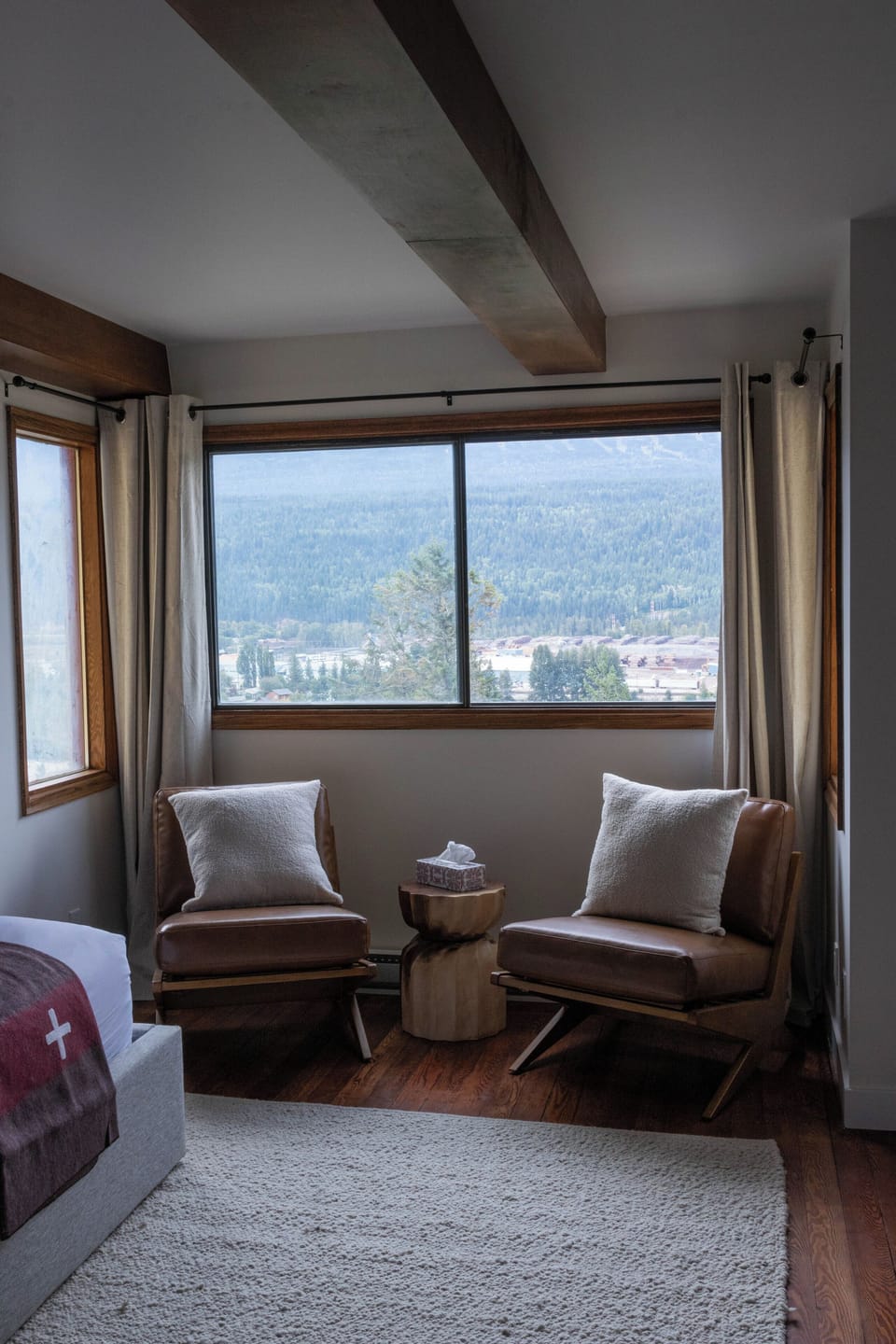 Unwind in this serene corner with inviting chairs, ready for moments of peace and reflection.