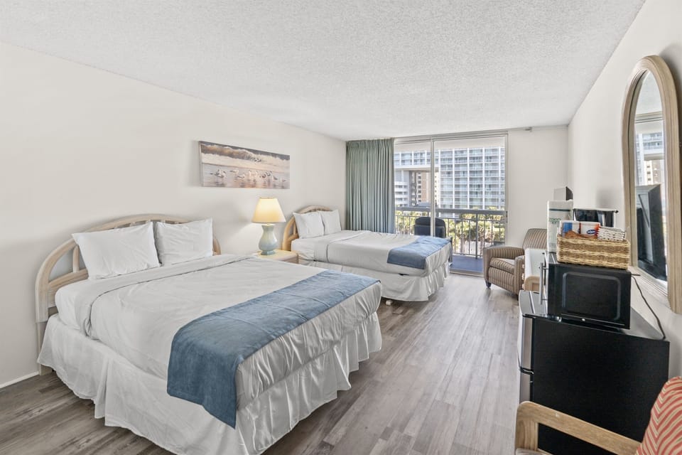 Queen beds in bedroom