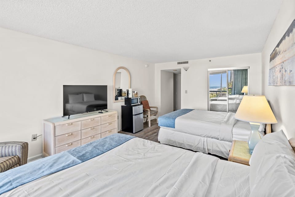 Queen beds in bedroom