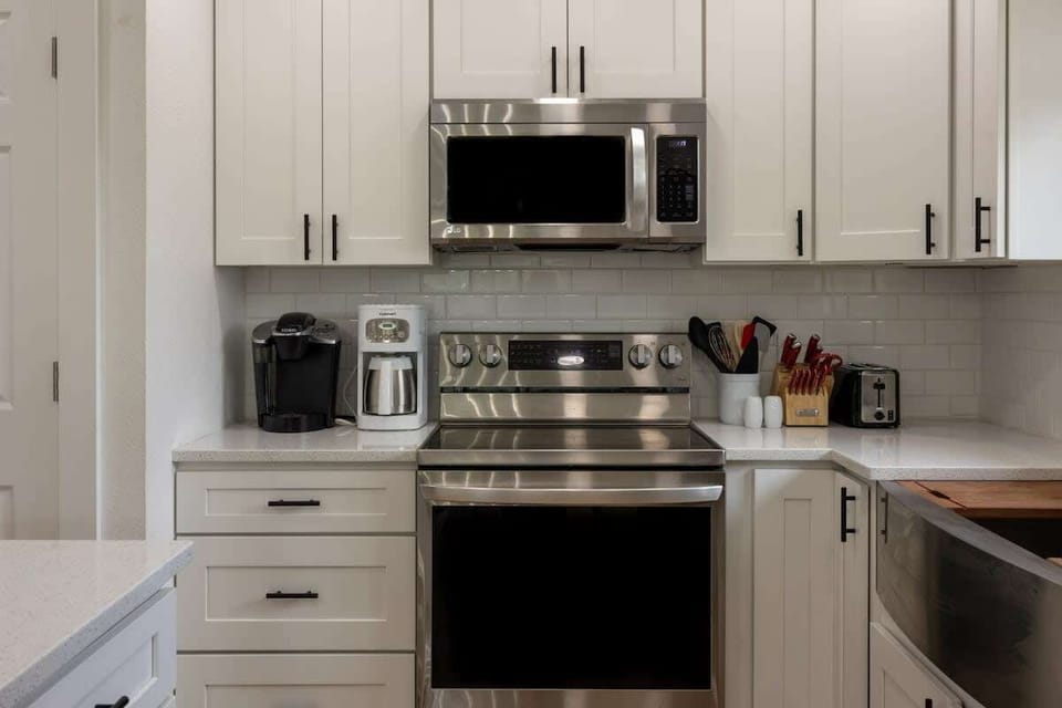 "Modern kitchen with ample counter space and appliances."