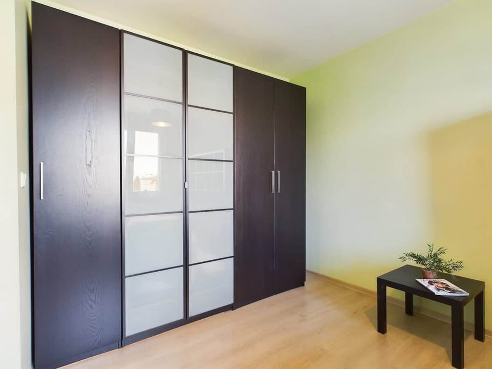 The room has a large wardrobe to accommodate all necessary luggage and accessories.