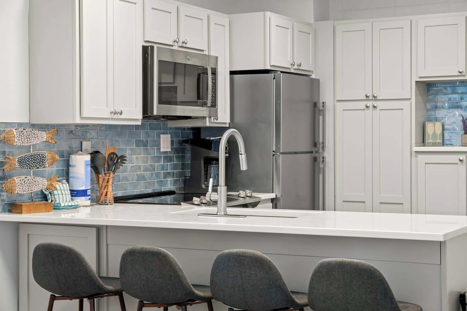 Our breakfast bar, seating 4, is right by the windows in the open area off the living room.