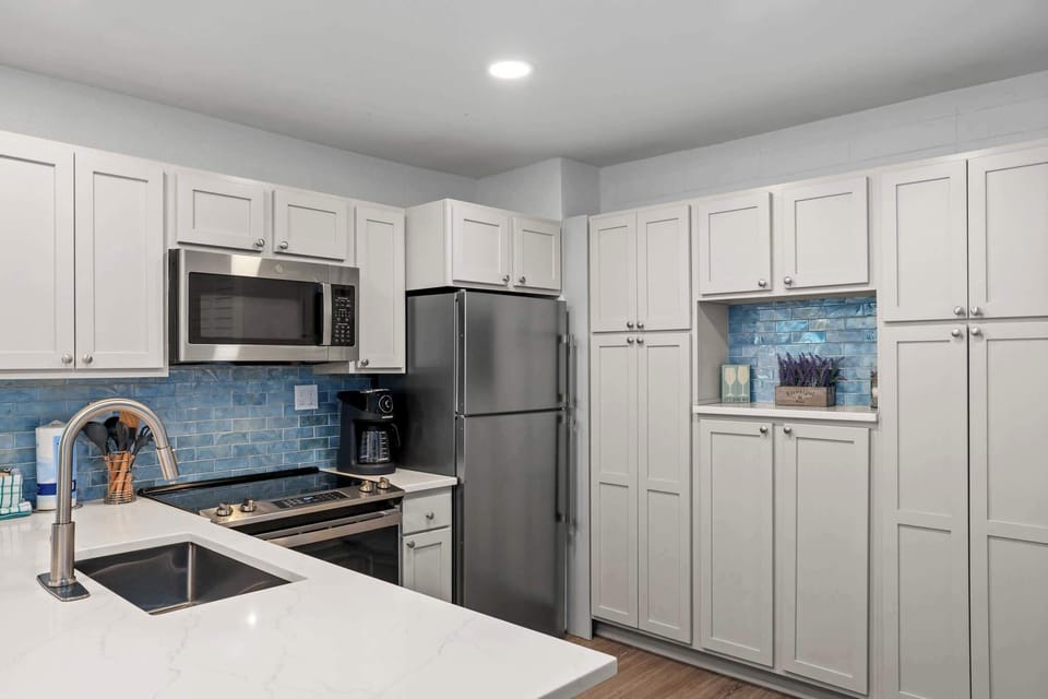 We've stocked this kitchen with full appliances, dishes, bake ware, pots & pans, silverware, utensils, crockpot, blender, and a traditional coffee maker & Keurig!