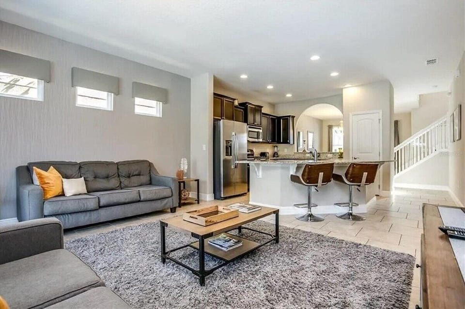 Living area with Kitchen and stairs View
