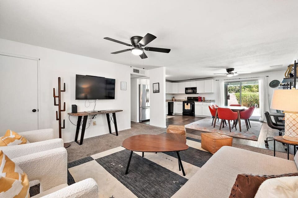 Cozy and inviting living space with plush seating and a smart TV.