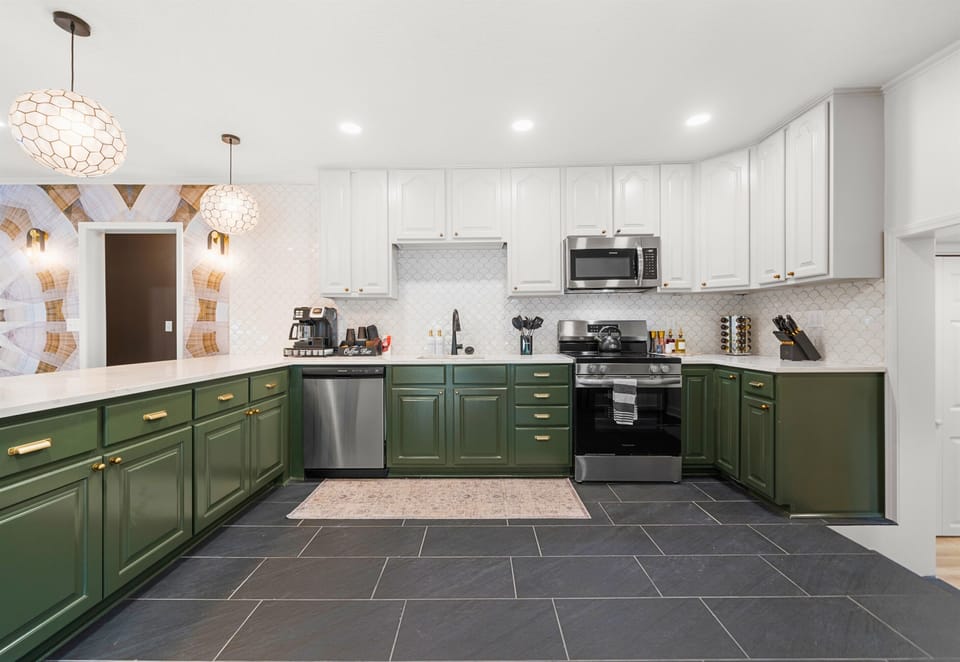 The sleek, spacious kitchen is ideal for both cooking and socializing, offering a perfect blend of form and function.