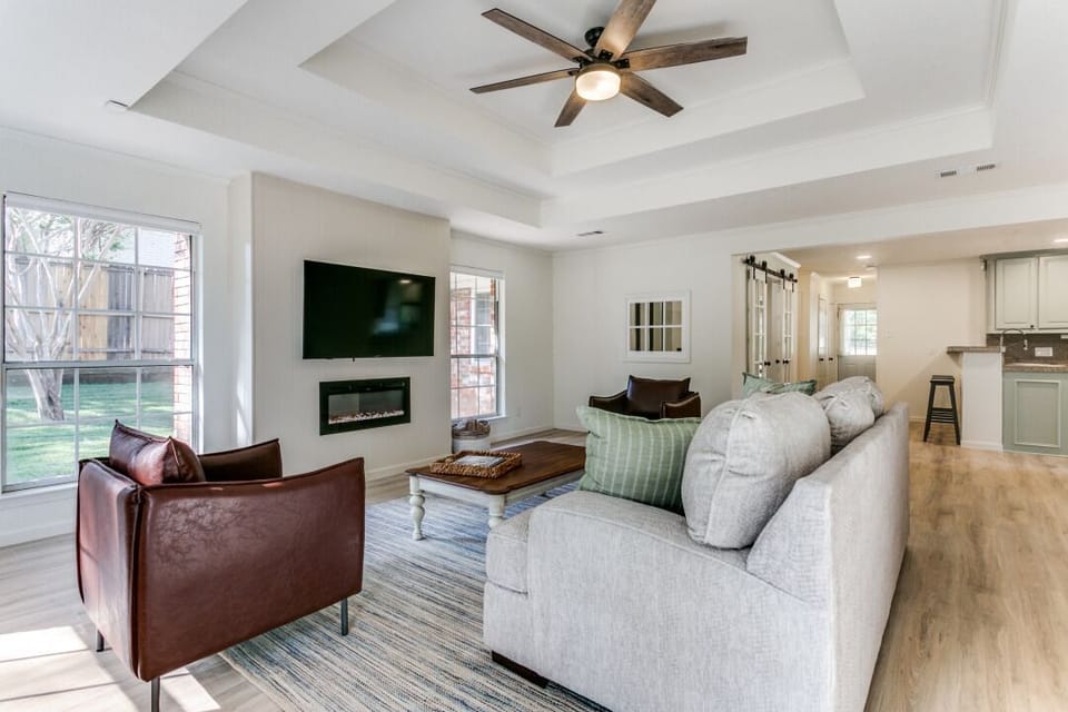 Living Room with an electric, remote-controlled, fireplace, and a Smart TV.