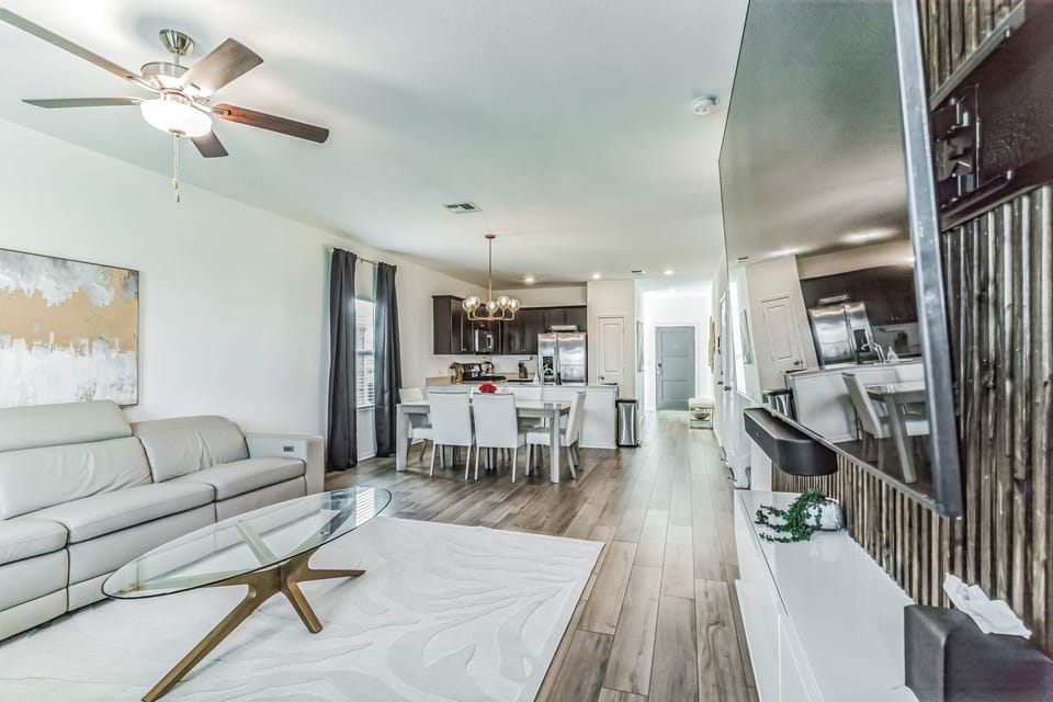 Living room with view of dining room and kitchen