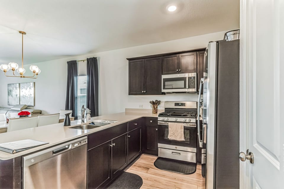 Full kitchen with utensils, air fryer, espresso machine, appliances 