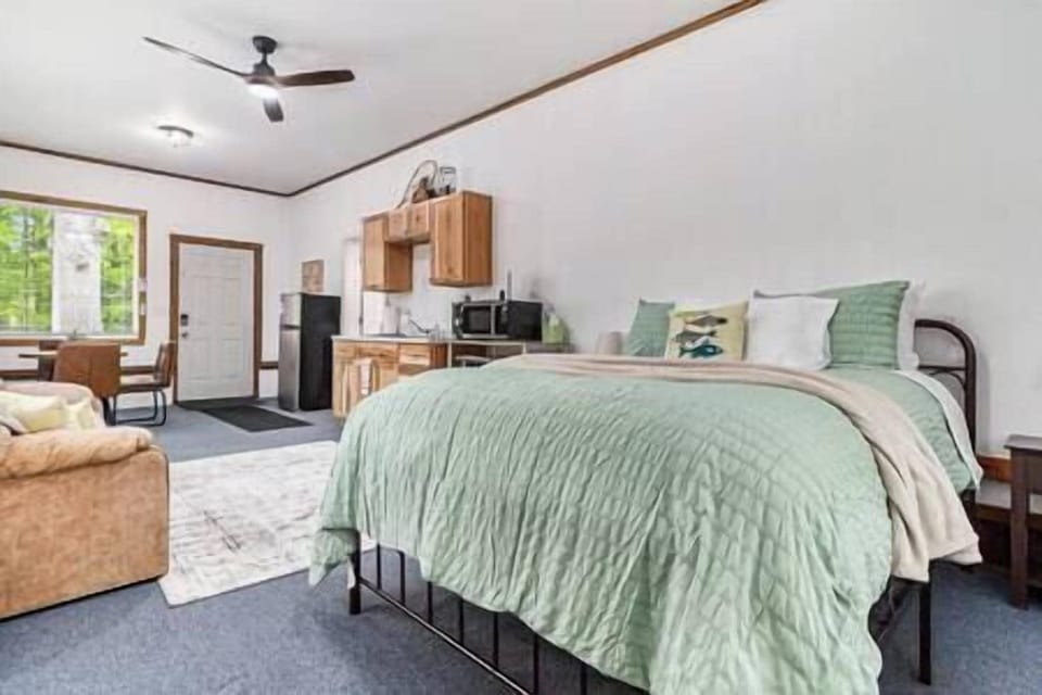 The Studio offers a kitchenette, queen bed, queen sofa sleeper, table and chairs.