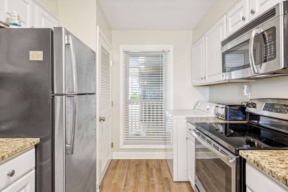 Fully stocked kitchen with stainless steel appliances