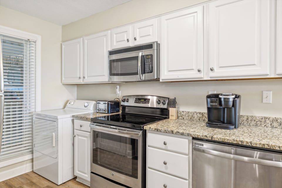 Fully stocked kitchen with stainless steel appliances