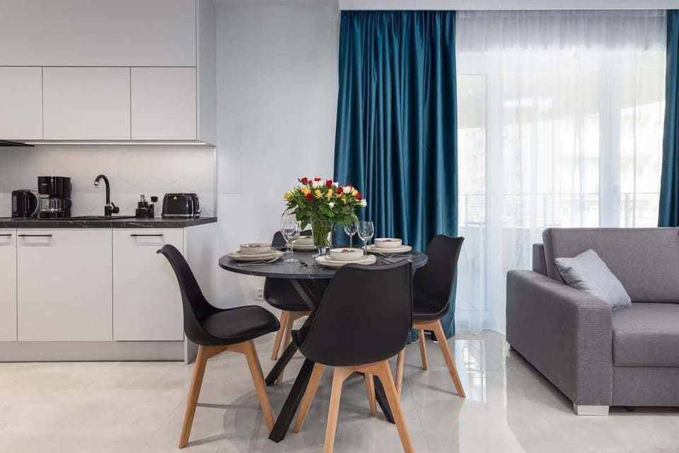 Large table with chairs for eating communal meals. 