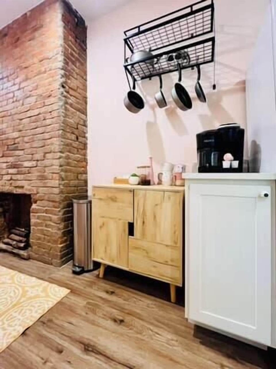 [Kitchen Area] A small part of the kitchen where you can see the pans and all the equipment.