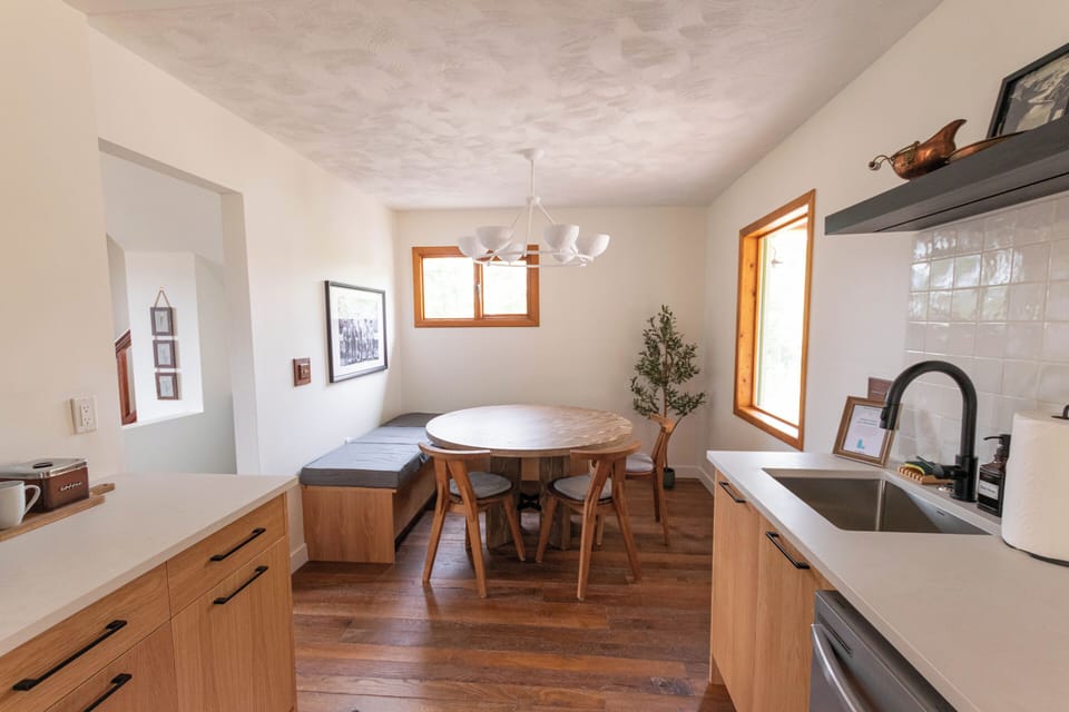 Enjoy meals and moments with loved ones around the cozy round table nestled by the windows.