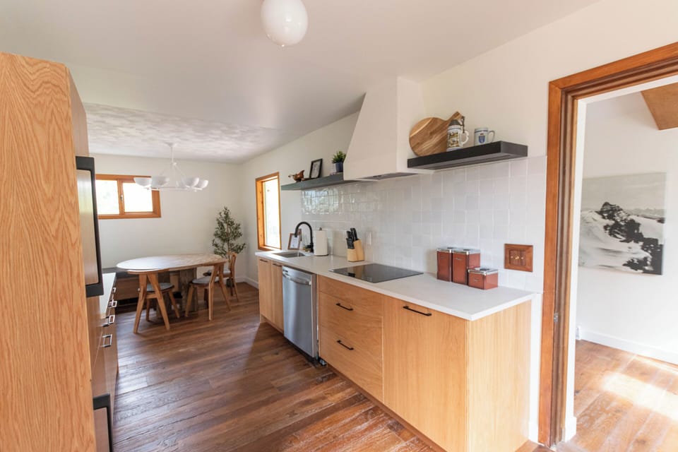 Cook and gather in this warm, inviting kitchen with modern appliances and natural light.