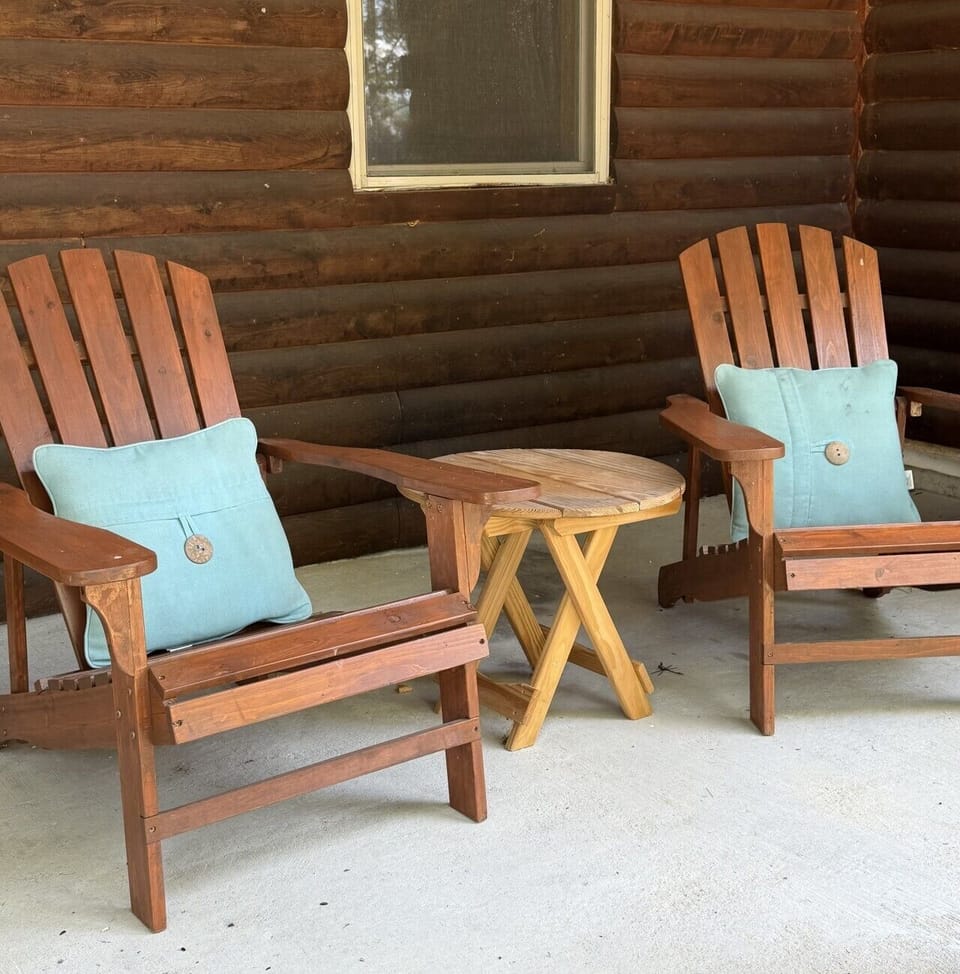 Relax in the Adirondack chairs on the covered front patio—the perfect spot to enjoy your morning coffee or unwind after a day of exploring.