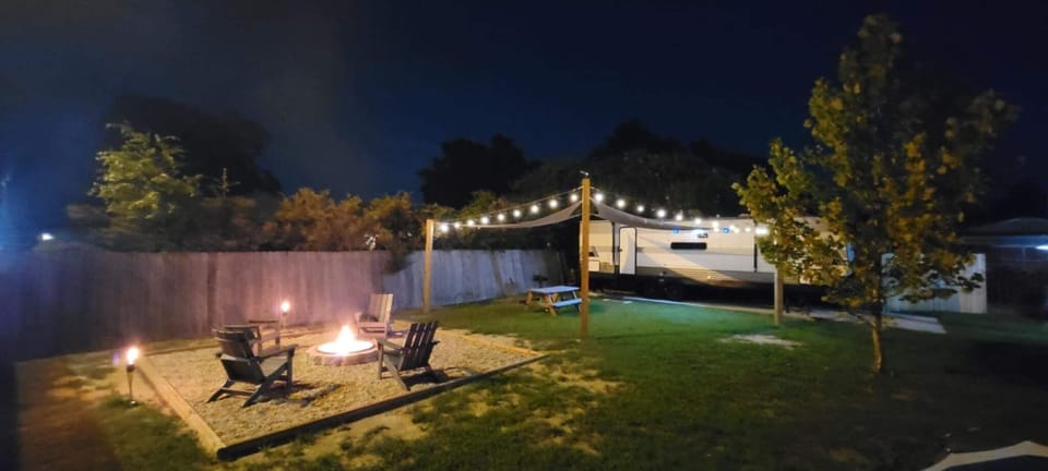 Grill dinner for outdoor dining under bistro lighting.