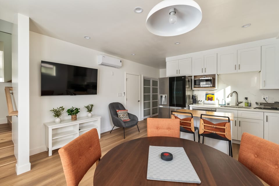 Open plan dining with kitchen attached downstairs