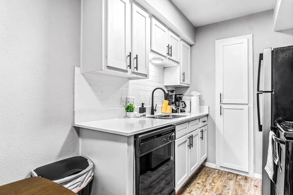 As you open the kitchen, you discover an assortment of coffee pods, and sugar, ensuring you have everything you need for a perfect morning or afternoon pick-me-up.