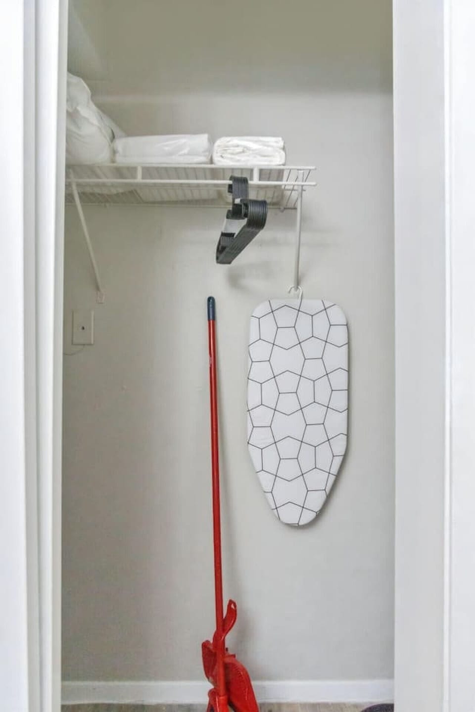 Modern built-in closets with hangers and shelving, perfect for keeping your clothes organized during your stay.