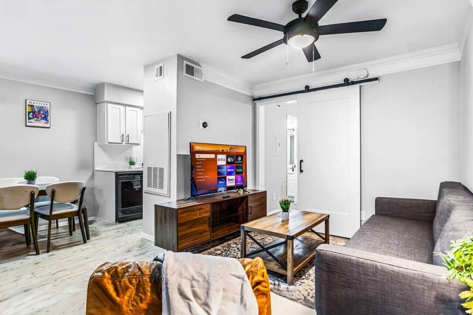 You feel a sense of peace as you step into the living room , with its inviting decor and soothing tones.