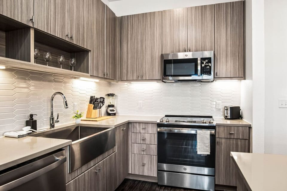 The kitchen invites you to experiment with new recipes, offering a stylish and practical space to cook and create.