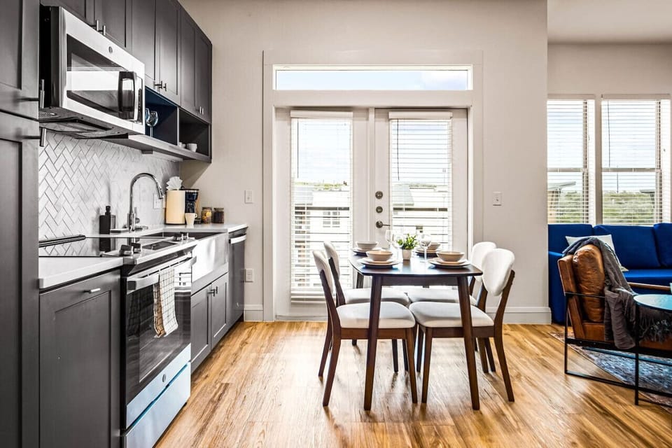 Set the table for memorable meals in this beautifully arranged dining area. With elegant place settings and a charming centerpiece, it's perfect for hosting dinner parties or enjoying family dinners in a cozy and stylish atmosphere.