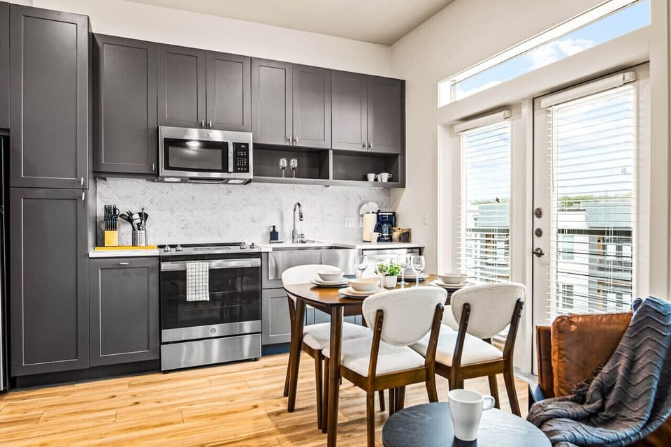 You’ll love the convenience of this fully equipped kitchen, where you can brew coffee, cook meals, or prepare snacks. The cozy layout and warm ambiance make cooking here a delightful part of your stay.