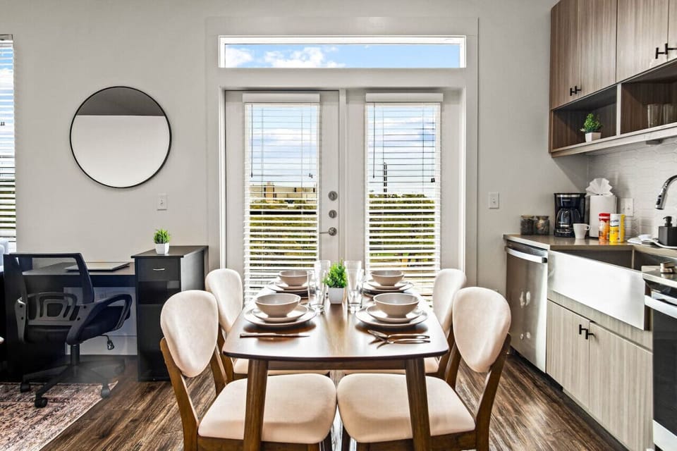 The dining room is bathed in natural light, creating a bright and inviting space where every meal feels special.