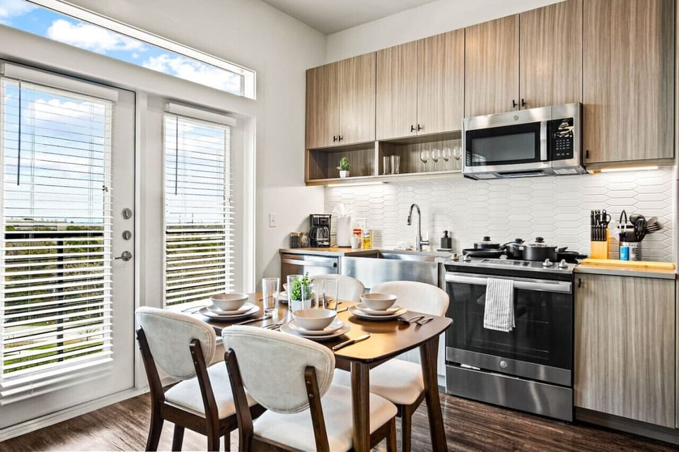 The dining room is bathed in natural light, creating a bright and inviting space where every meal feels special.