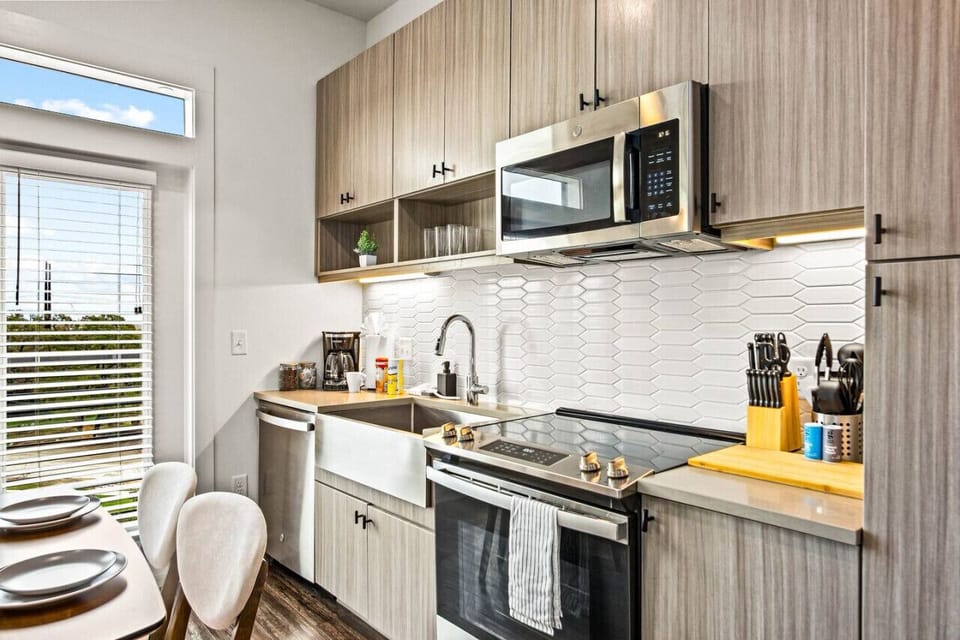 The kitchen invites you to experiment with new recipes, offering a stylish and practical space to cook and create.