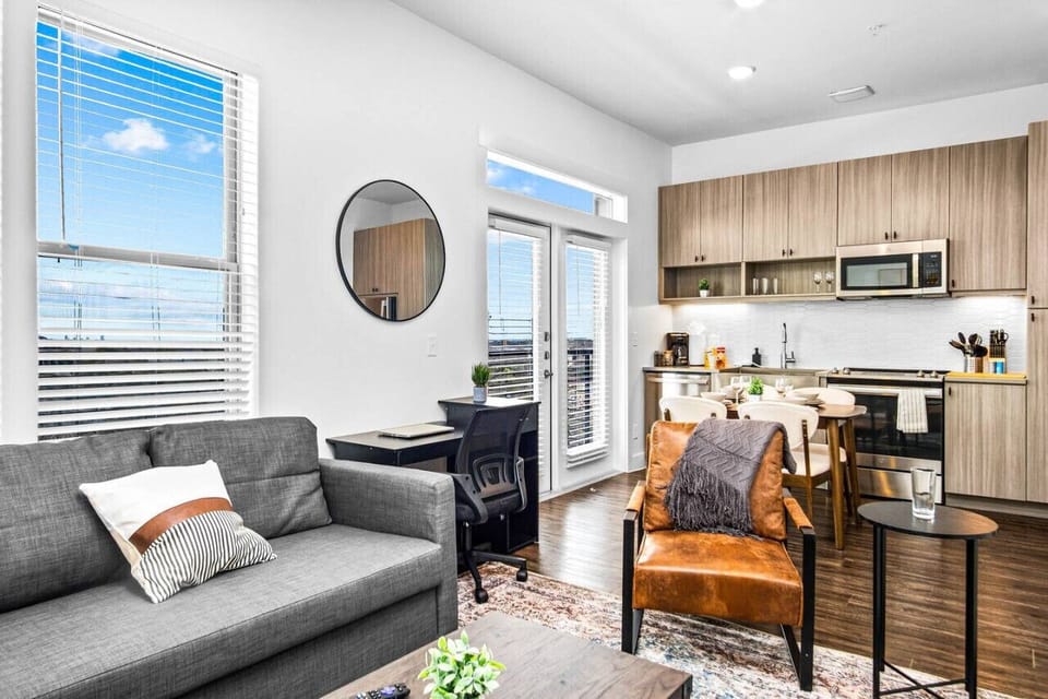 You feel at home as you settle into the living room, where the inviting atmosphere is perfect for lounging or entertaining.