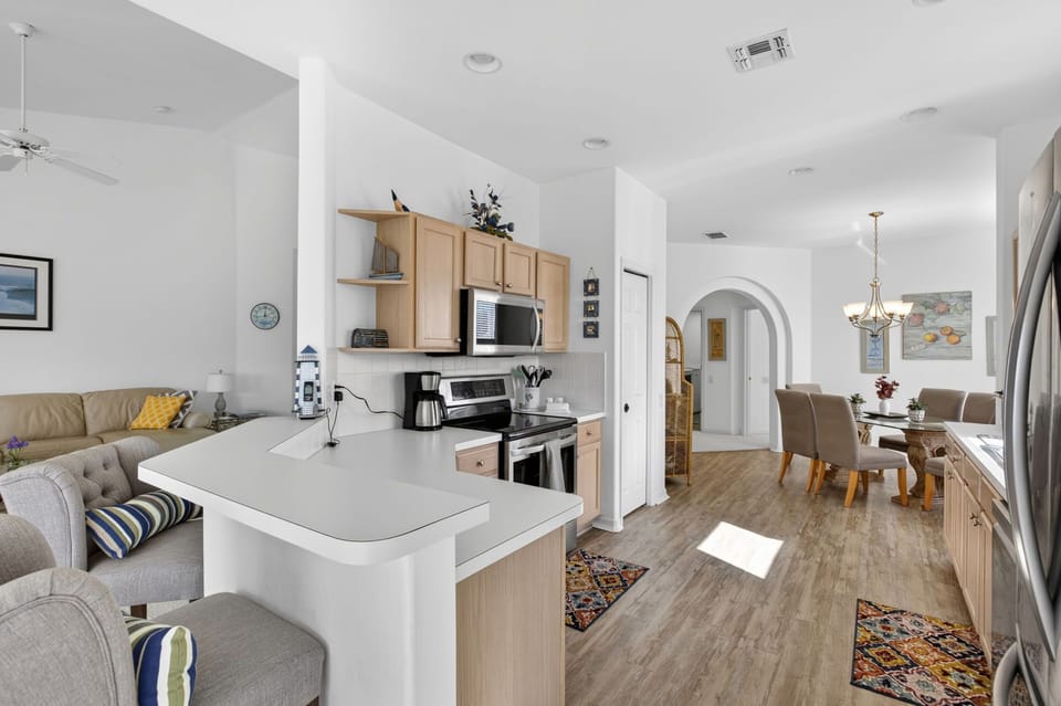 Open-concept living space where the kitchen, dining, and lounge flow seamlessly together.
