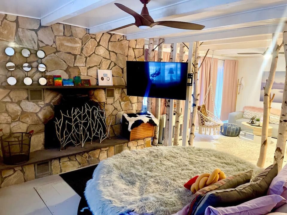 We love the fireplace infront of the custom build bed.