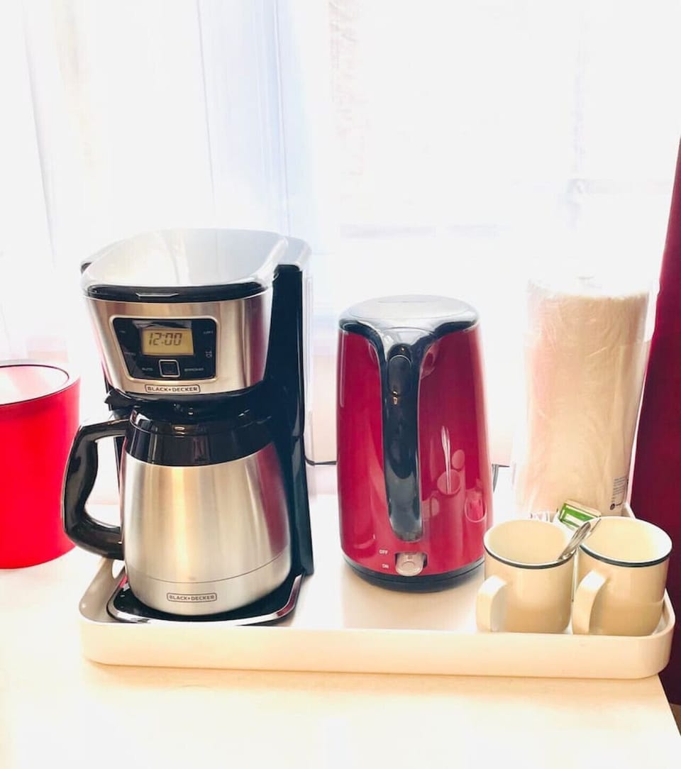 Modern coffee brewer and tea kettle create the perfect setup for slow Catskills mornings and cozy mountain relaxation.