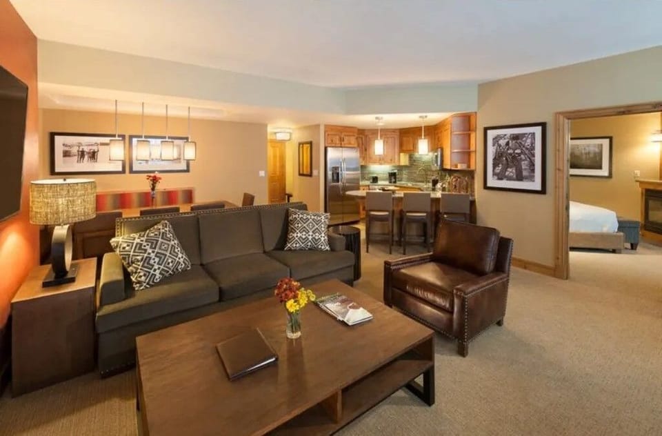 Warm living room with ample seating and soft lighting.