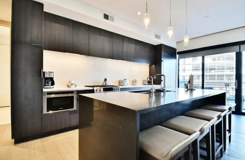 Modern kitchen with a large island and sleek design.