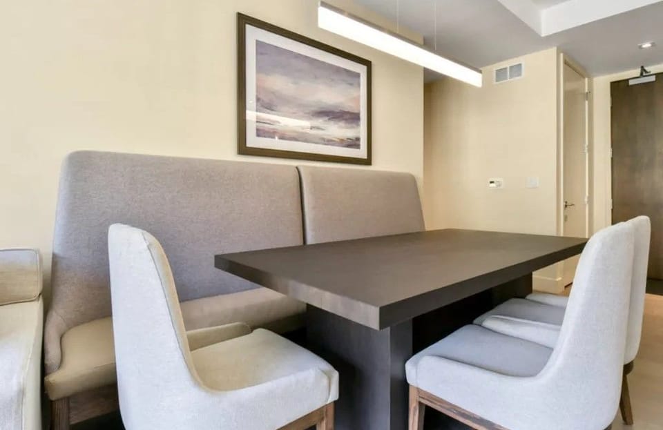 Elegant dining area with seating for six and modern decor