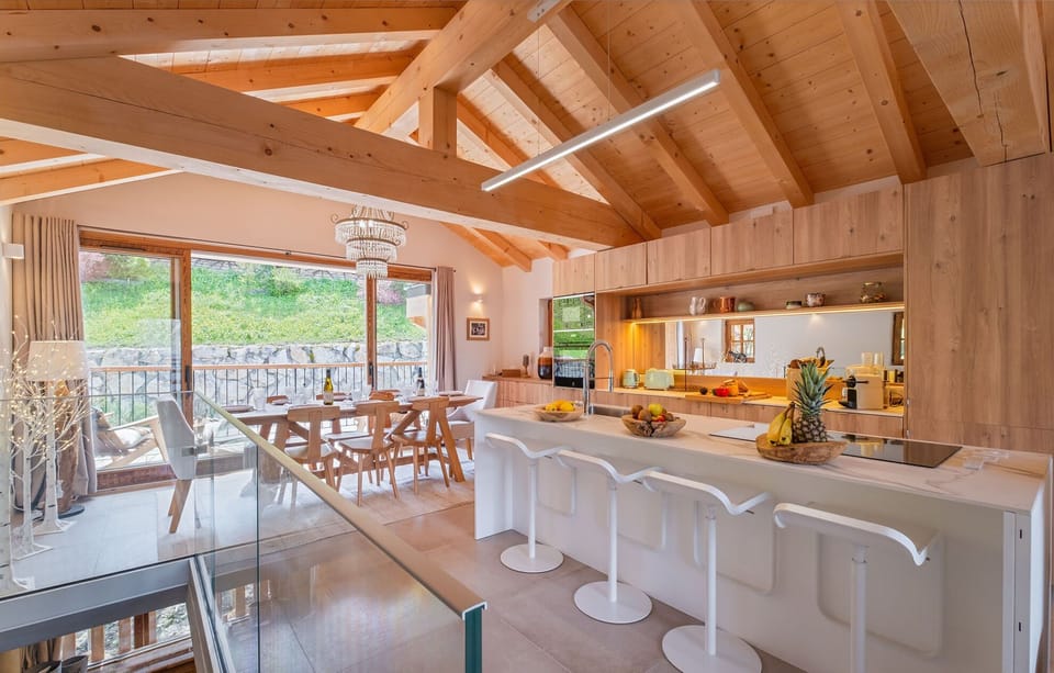 Cook and dine in style in this modern kitchen, complete with high-end appliances and a large dining area. 