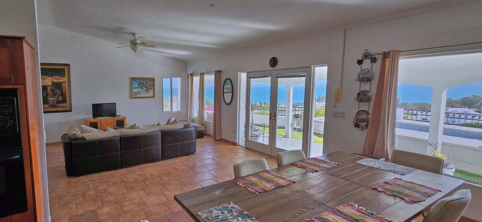 living room and dining room with sea view