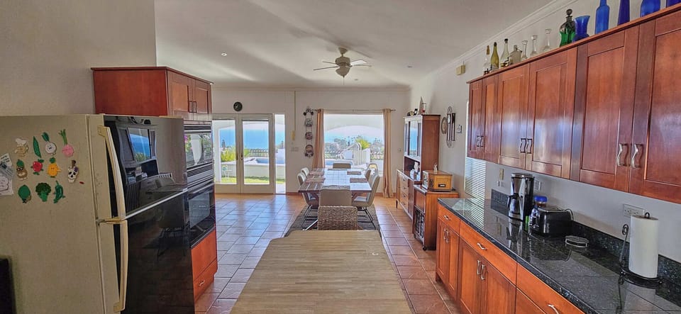 kitchen-dining room and pool view