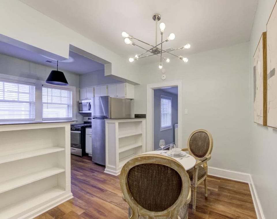 Enjoy a cozy meal in this stylish dining nook, perfect for morning coffee or an intimate dinner.