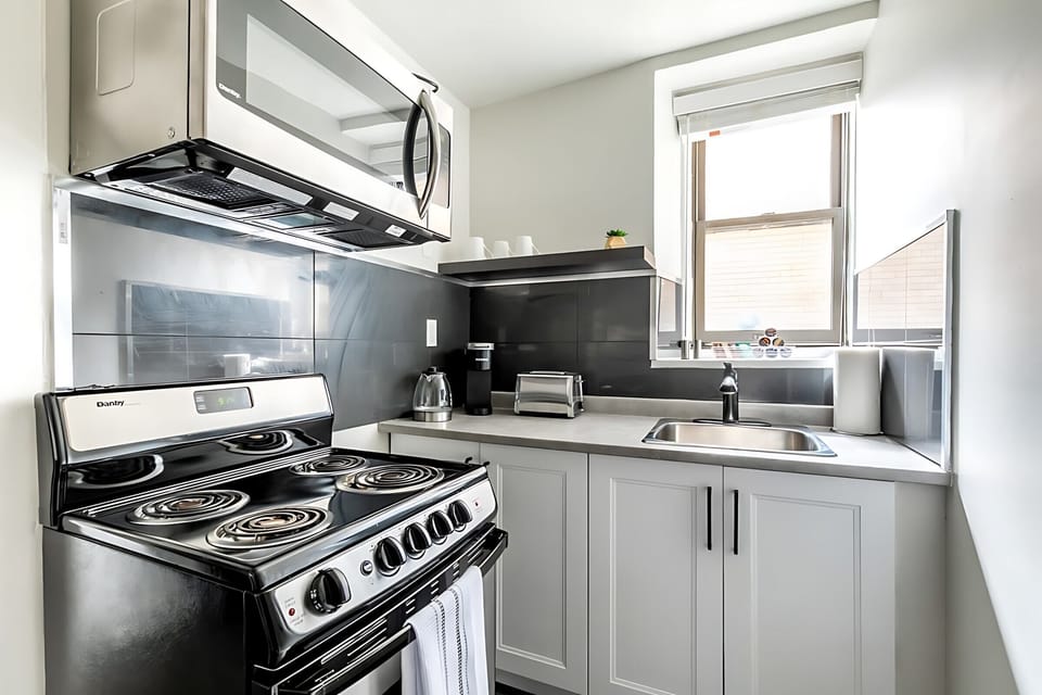 Compact Kitchen With Modern Appliances And Sleek Finishes